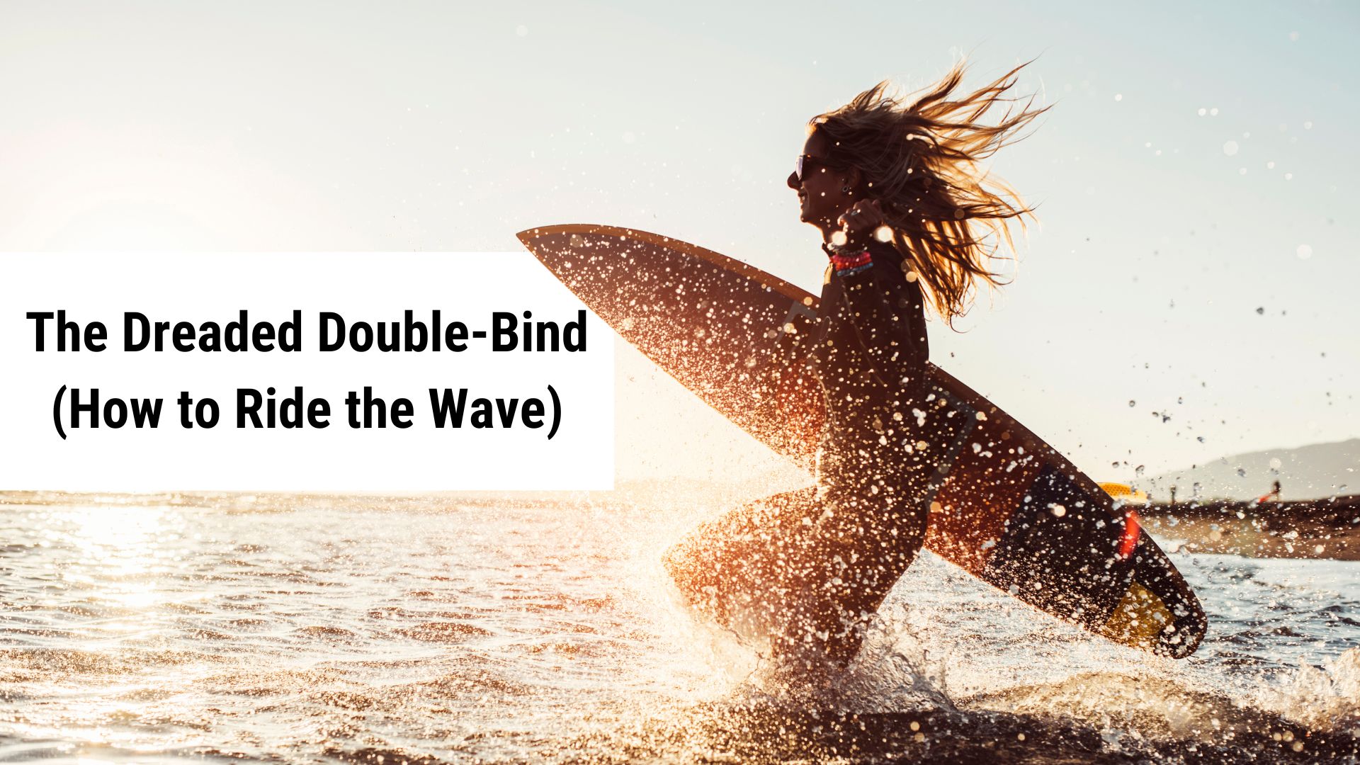 Woman running into the ocean with a surfboard